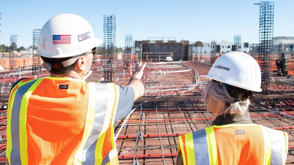 Woman and man talking in a construction zone