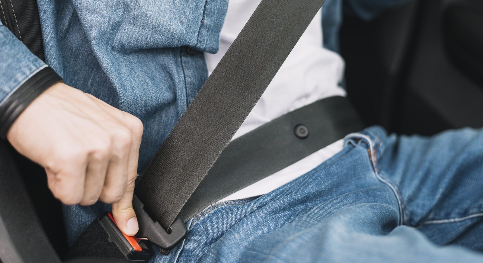 close-up-man-putting-safety-belt