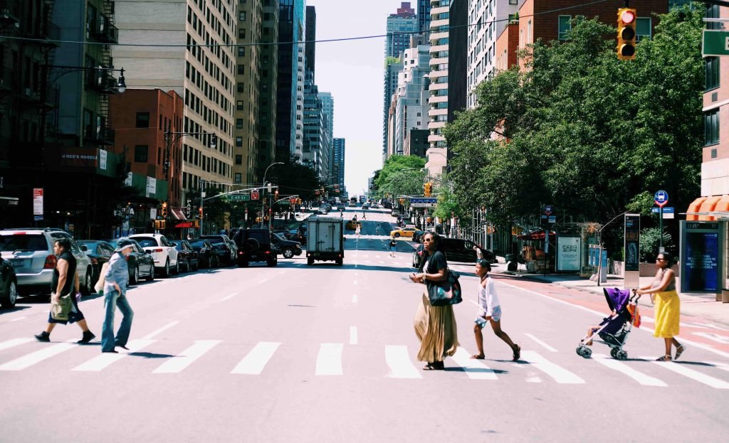 people walking in a crosswalk