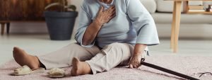 an elderly person lying on the floor of a nursing home.